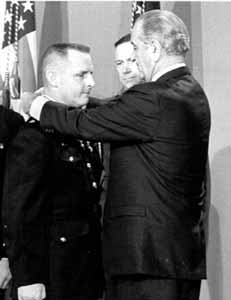 Vietnam War Congressional Medal of Honor Recipient Major Stephen W. Pless, USMC - President Lyndon B. Johnson presents the Medal of Honor to Maj. Stephen W. Pless during a White House ceremony. Pless was the first, and only, Marine aviator to receive the medal for service during the war in Vietnam.